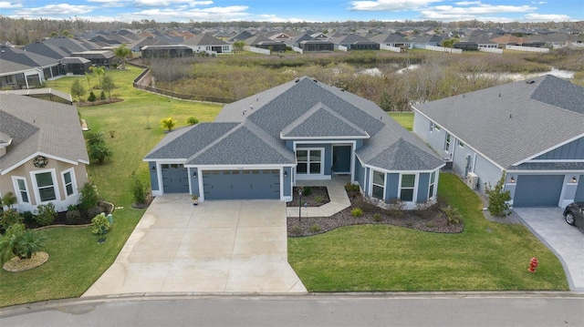 birds eye view of property with a residential view