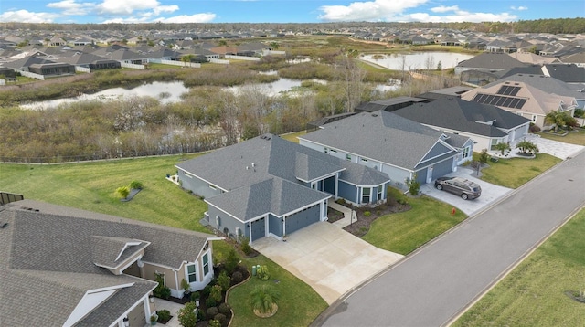 aerial view with a residential view and a water view