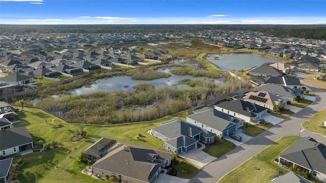 aerial view featuring a residential view and a water view