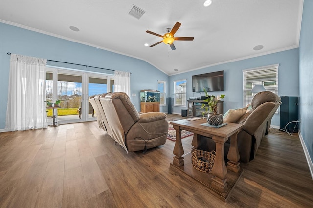 living room featuring visible vents, crown molding, a ceiling fan, and wood finished floors