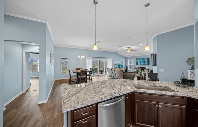 kitchen featuring dark wood finished floors, ornamental molding, a sink, dark brown cabinets, and stainless steel dishwasher