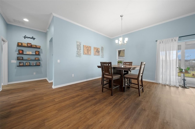 dining space featuring visible vents, baseboards, and wood finished floors