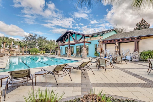 view of swimming pool featuring a patio area