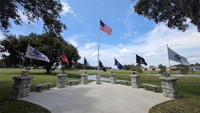 view of community featuring a yard and a patio area