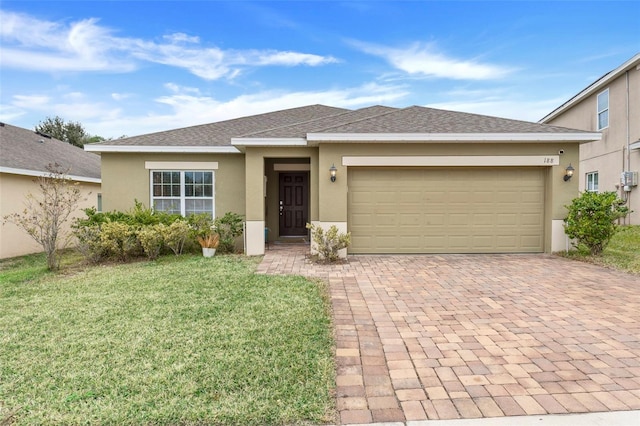 view of front facade featuring a front yard and a garage