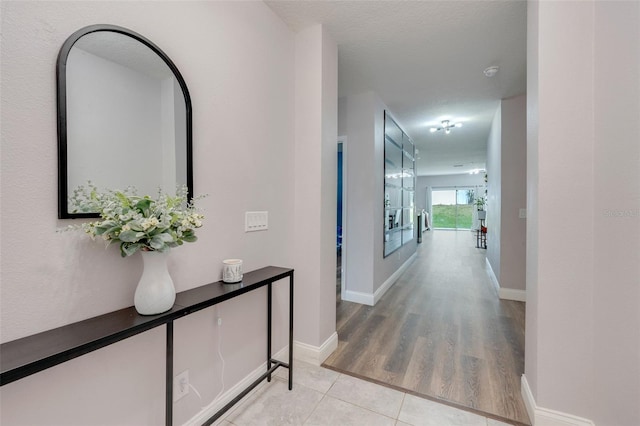 hallway featuring a textured ceiling