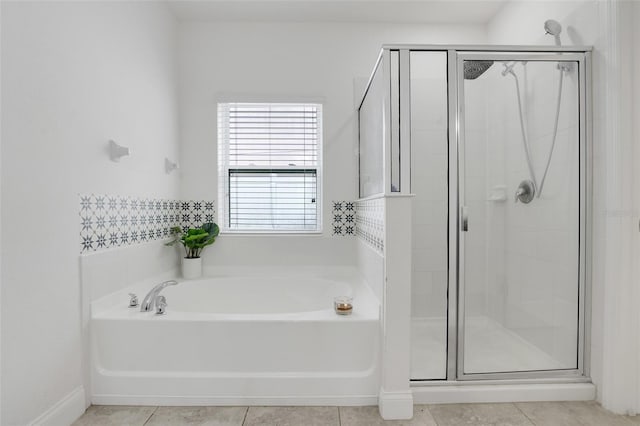 bathroom with tile patterned floors and separate shower and tub