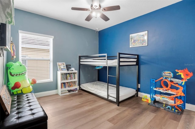 bedroom featuring ceiling fan and wood-type flooring