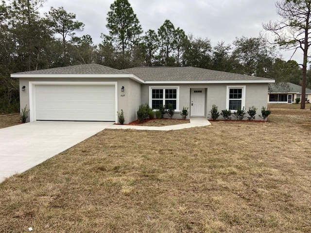 ranch-style home with a front lawn and a garage