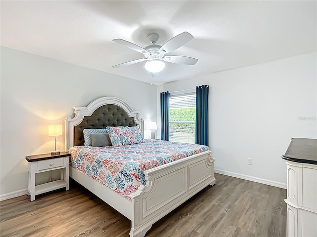 bedroom with ceiling fan and hardwood / wood-style floors