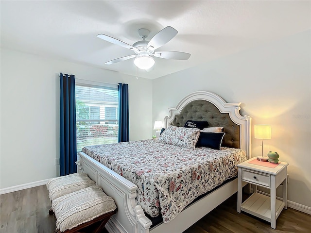 bedroom featuring ceiling fan and dark wood-type flooring