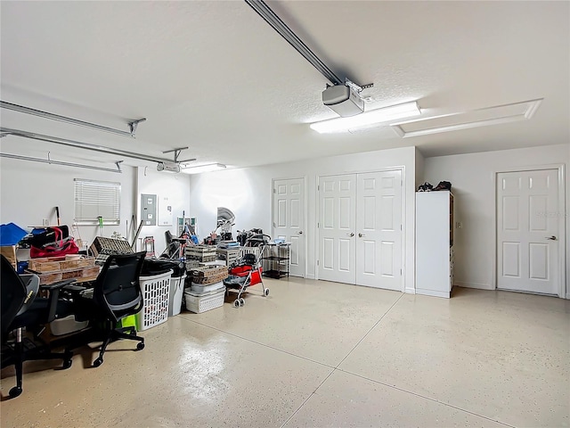 garage featuring a garage door opener and electric panel