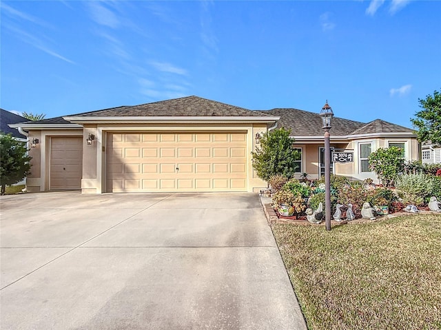 view of front facade featuring a front yard and a garage