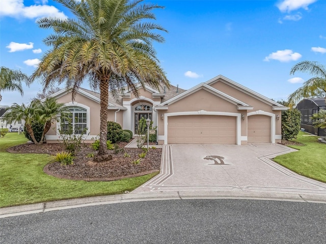 view of front facade with a garage and a front lawn