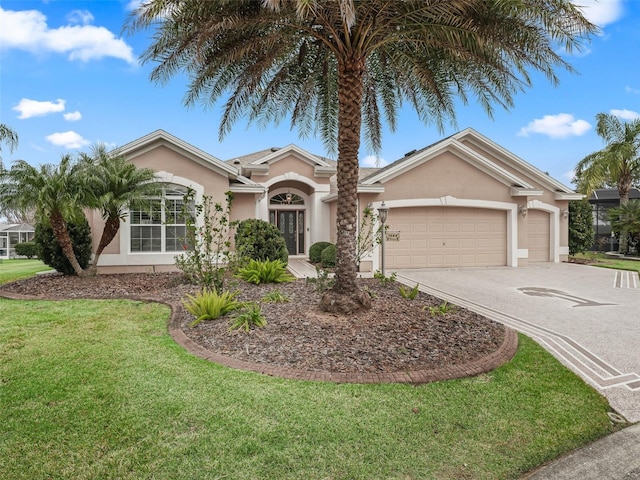 single story home featuring a garage and a front yard