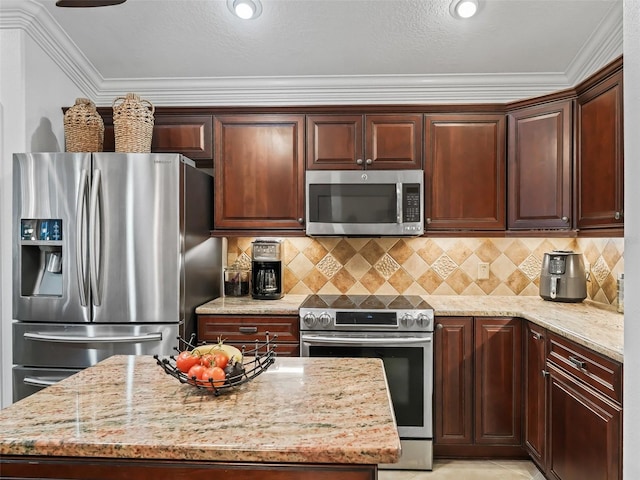 kitchen with crown molding, decorative backsplash, light stone countertops, and appliances with stainless steel finishes