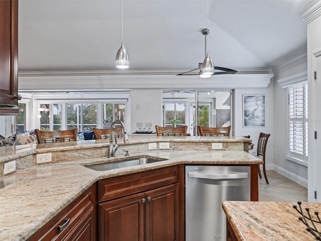 kitchen with sink, stainless steel dishwasher, hanging light fixtures, and light stone countertops