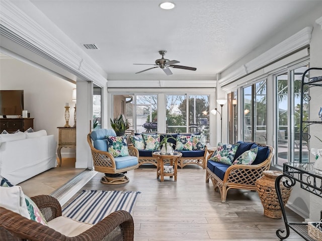 sunroom / solarium with ceiling fan