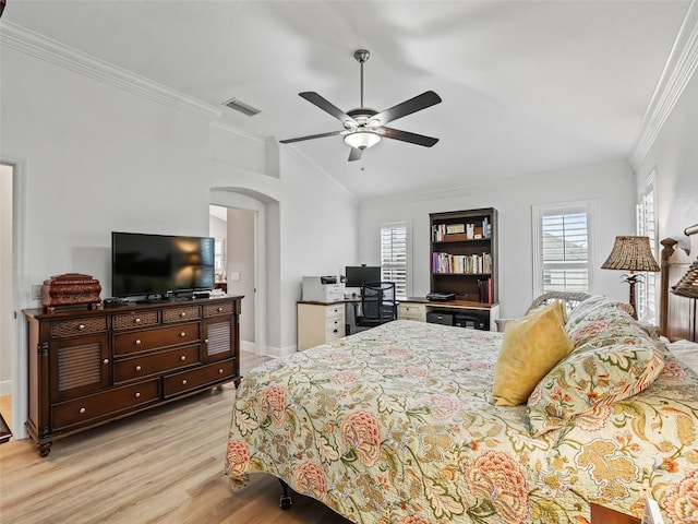 bedroom with crown molding, lofted ceiling, ceiling fan, and light hardwood / wood-style flooring