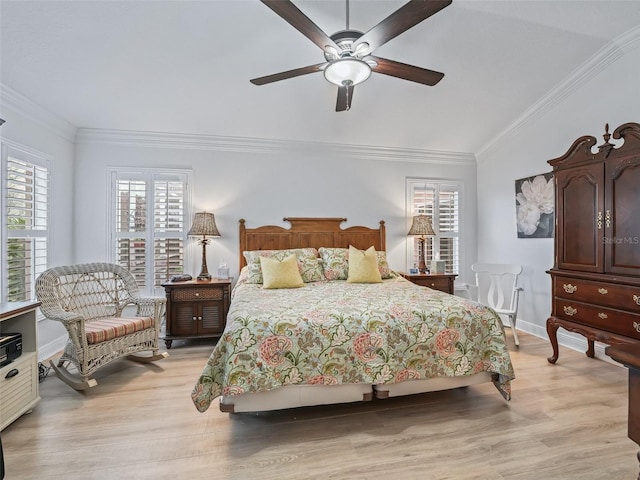 bedroom with ornamental molding, ceiling fan, and light hardwood / wood-style flooring