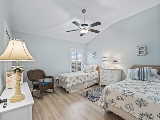 bedroom featuring vaulted ceiling, ceiling fan, and light hardwood / wood-style floors