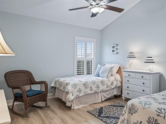 bedroom featuring vaulted ceiling, ceiling fan, and light hardwood / wood-style floors