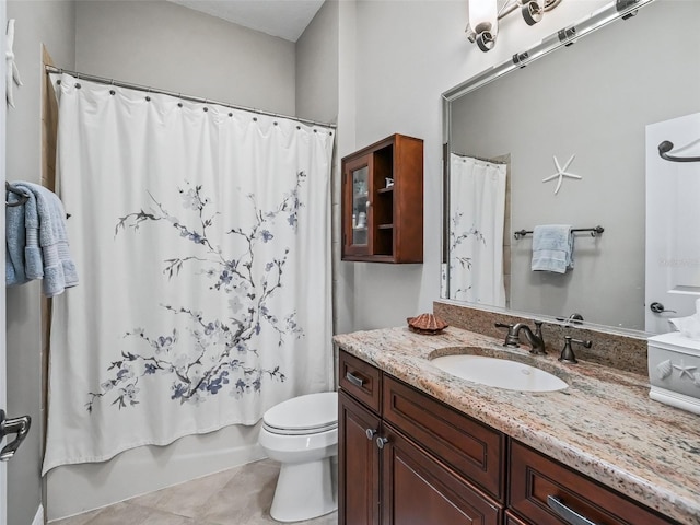 full bathroom featuring shower / tub combo, vanity, tile patterned floors, and toilet