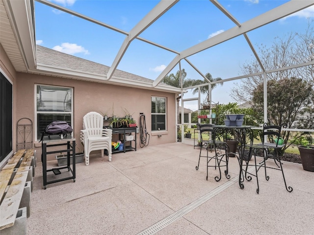 view of patio with a lanai