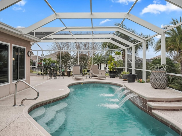 view of swimming pool featuring a patio, pool water feature, and glass enclosure