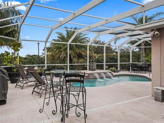 view of swimming pool featuring pool water feature, a jacuzzi, a patio area, and glass enclosure