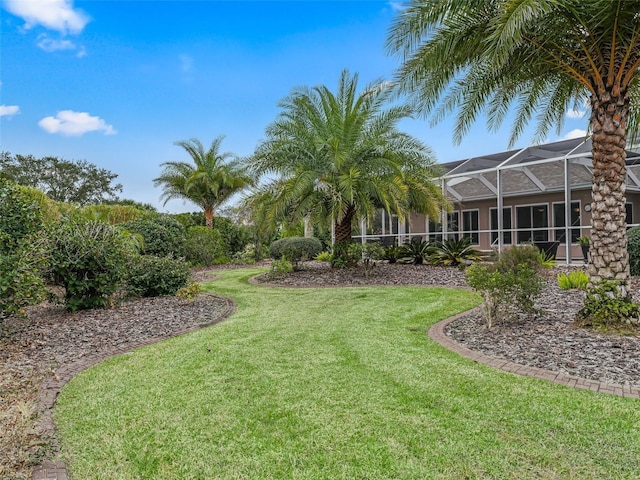 view of yard featuring a lanai