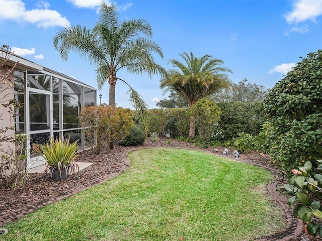 view of yard with a lanai