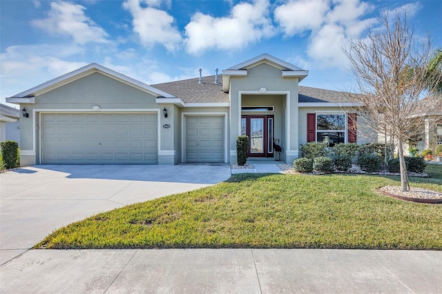 single story home with a front yard and a garage