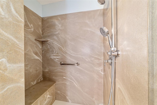 bathroom with a tile shower