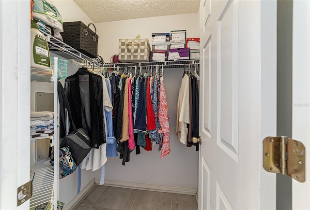 walk in closet featuring light tile patterned floors