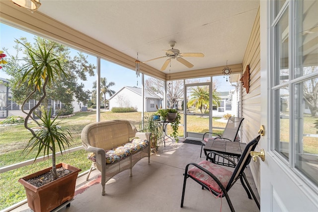 sunroom / solarium with ceiling fan