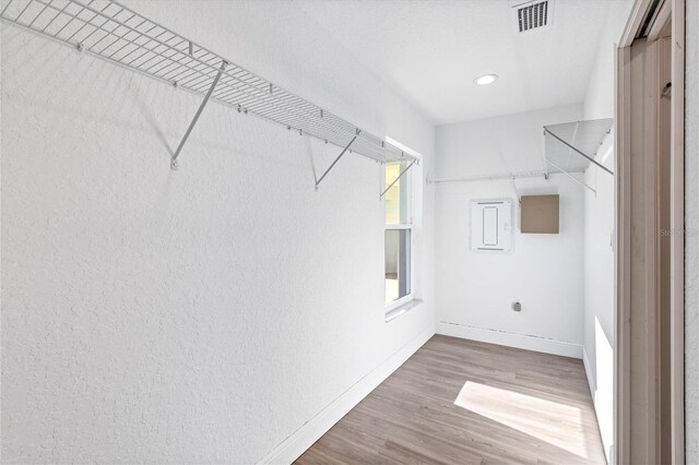 walk in closet featuring hardwood / wood-style floors