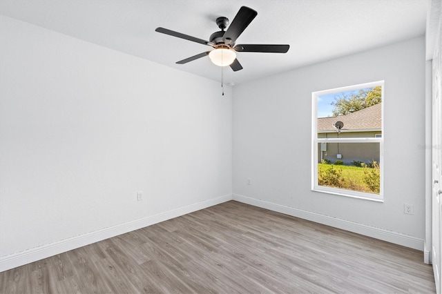 unfurnished room featuring ceiling fan, light hardwood / wood-style flooring, and plenty of natural light