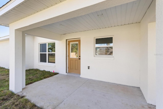 entrance to property with a patio area