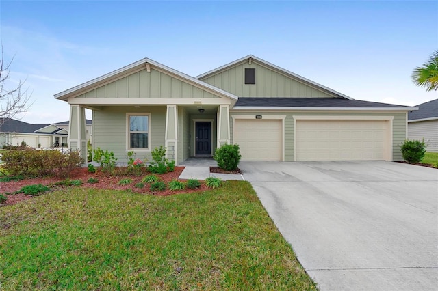 view of front of house with a garage and a front yard