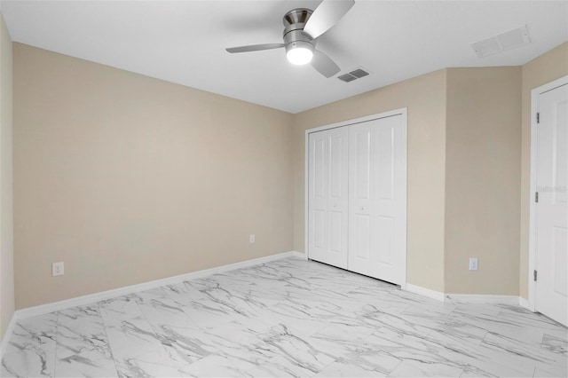 unfurnished bedroom with a closet and ceiling fan