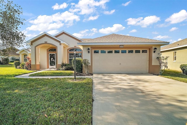 view of front of house with a garage and a front yard