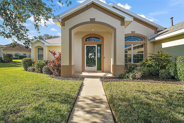 property entrance with a yard