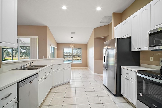 kitchen featuring stainless steel appliances, white cabinetry, and sink