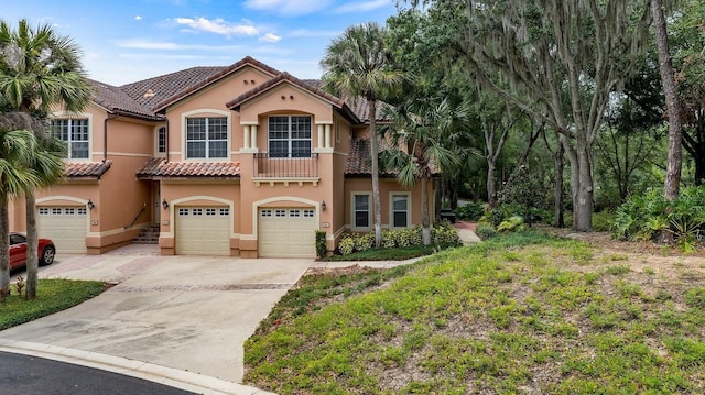 mediterranean / spanish-style home featuring a garage