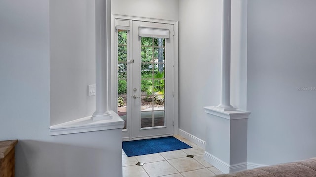 doorway with light tile patterned floors