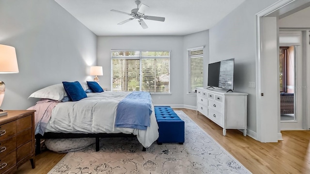 bedroom featuring ceiling fan and light hardwood / wood-style flooring