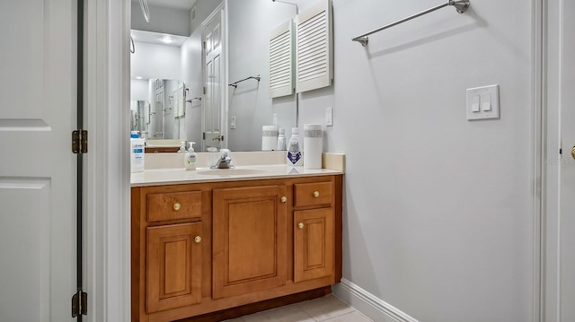 bathroom featuring tile patterned floors and vanity