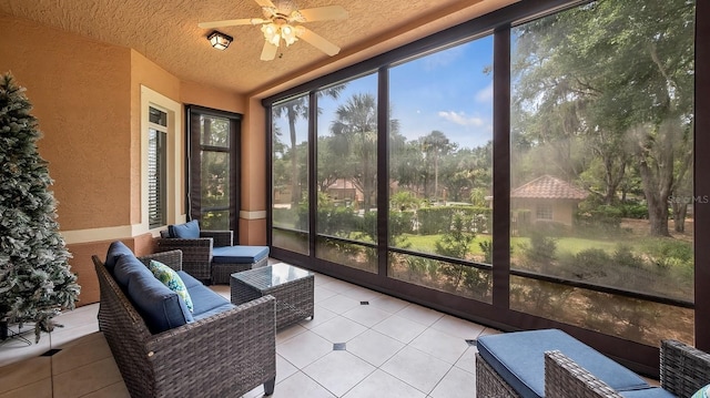 sunroom featuring ceiling fan