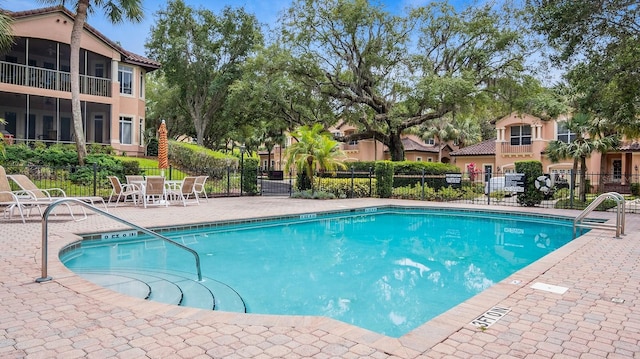 view of pool featuring a patio area